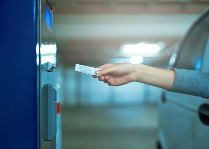 Scanning parking ticket to leave garage